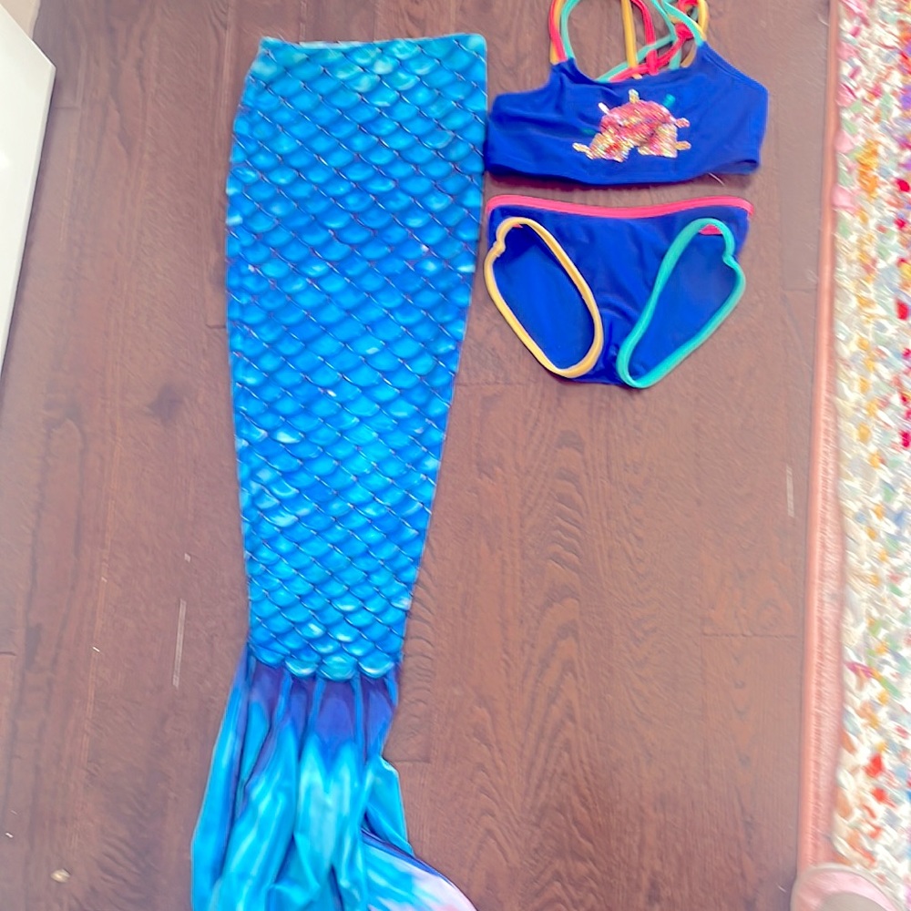 Selling fun in the sun mermaid swim suit.